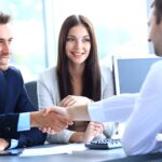 businessman shaking hands to seal a deal with his partner